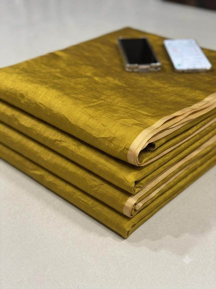 Rich mustard yellow Chanderi silk fabric with lustrous sheen, ideal for sarees and kurtas