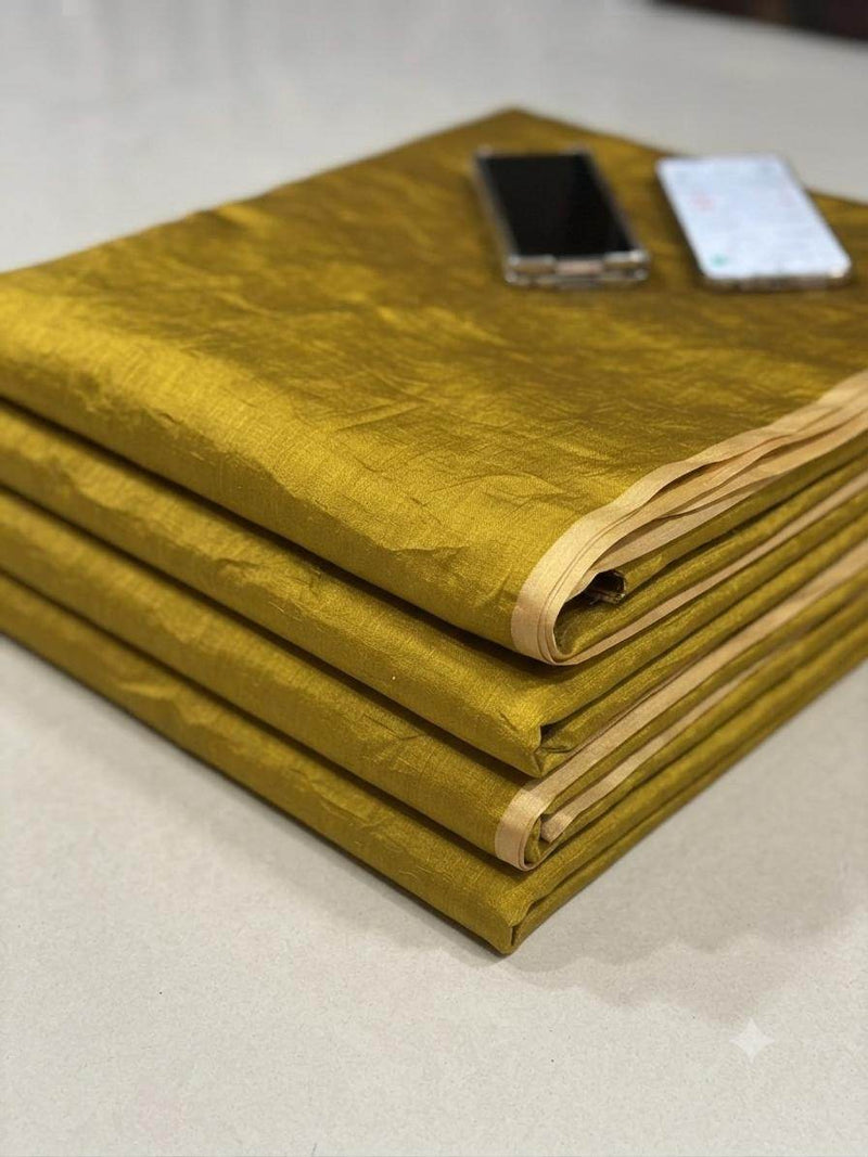 Rich mustard yellow Chanderi silk fabric with lustrous sheen, ideal for sarees and kurtas