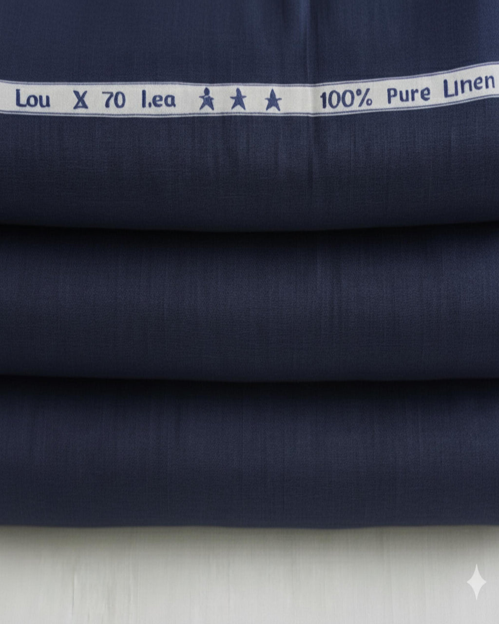 Navy fabric with white label reading '100% Pure Linen' on a light gray background