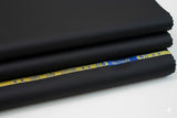 Stack of black fabric with 'Solitaire' branding on a white background