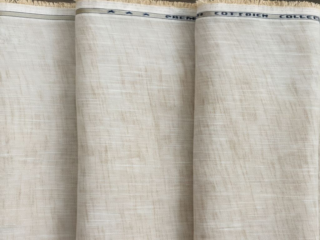 Close-up of beige fabric with 'Cottweiler' branding on a white background