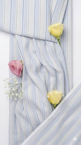 White shirting with light blue lines Fabric blend with cotton & polyster