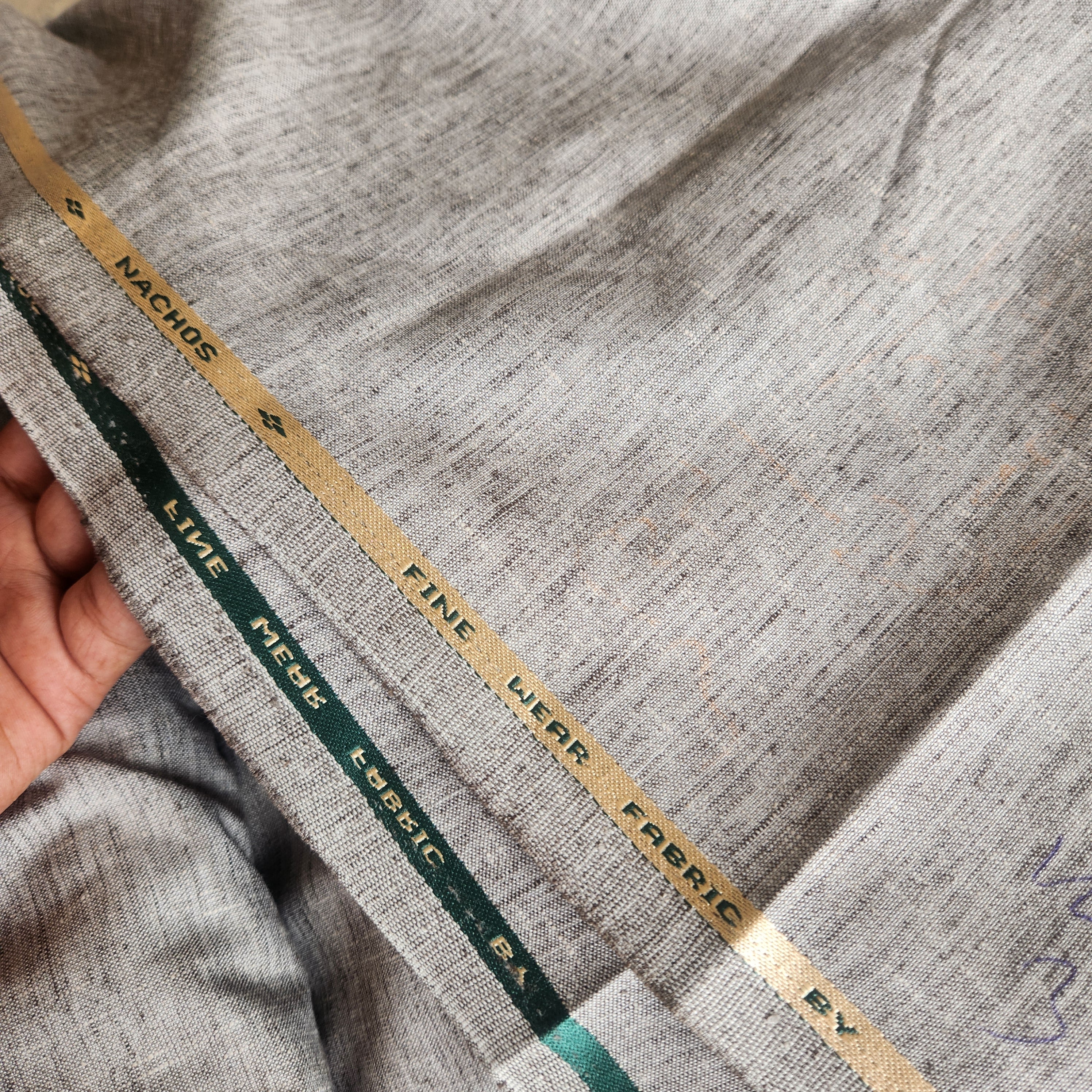 Sophisticated Grey melange with natural, earthy undertonesLinen-blend suiting Fabric