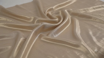 Champagne Gold heavily infused with a golden undertone.
Metallic Shimmer Fabric